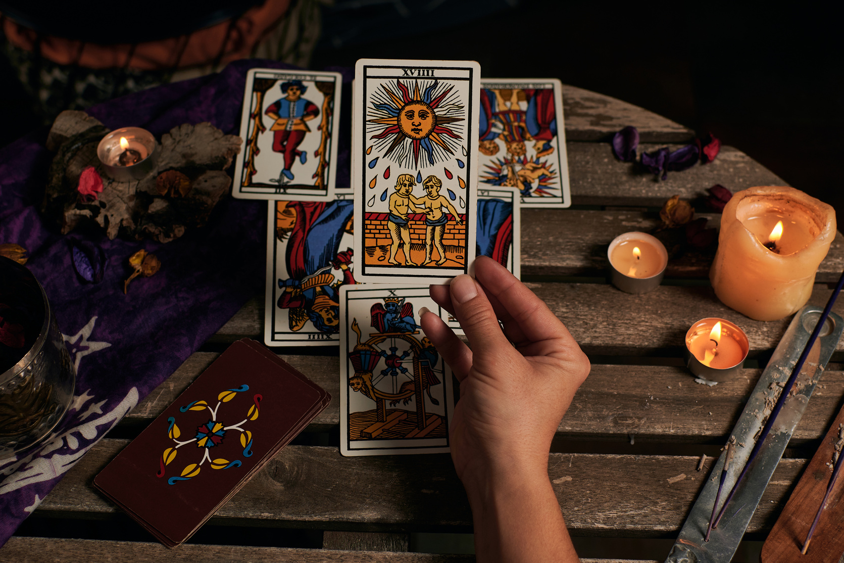 Hand Holding Tarot Card